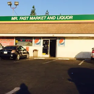 a car parked in front of a gas station