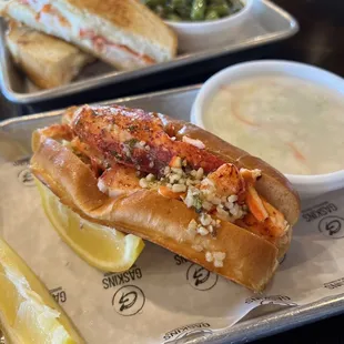 a hot dog with a side of dip