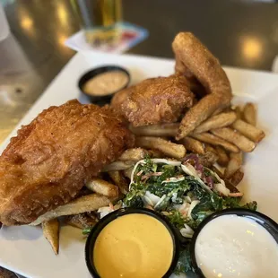 a plate of fried fish and fries