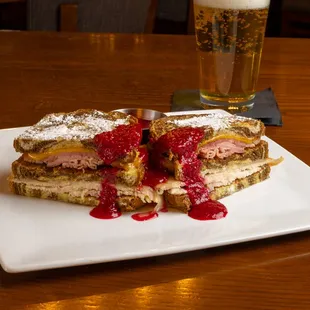 a plate of food and a glass of beer