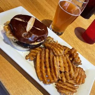 Beer Pretzel burger with waffle fries and a local beer