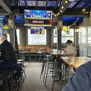 a man sitting at a table in a restaurant