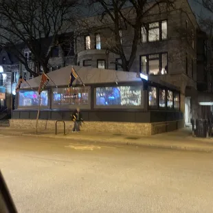 a man walking down a street at night