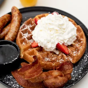 a plate of waffles and bacon