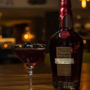 a bottle and a glass of wine