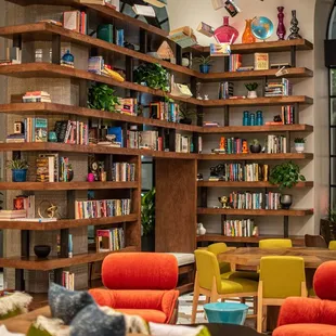 a living room with bookshelves