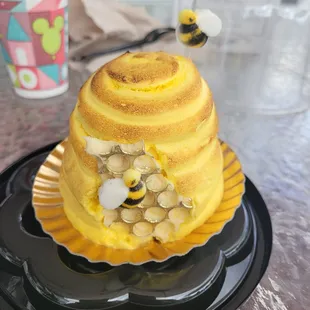 a cake with a bee on top