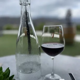 a glass of wine and a bottle of wine