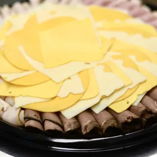 a platter of meat and cheese