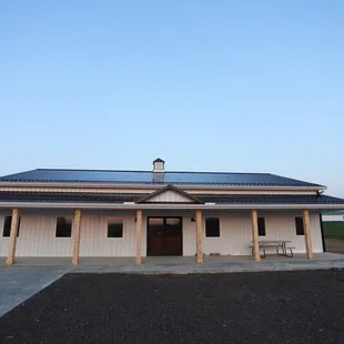 a building with a solar array on the roof