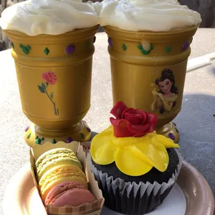 Leroy's brew in a souvenir goblet, macarons, and rose cupcake