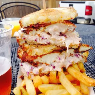 a plate of french fries and a glass of beer