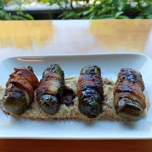 Bacon wrapped dolmades