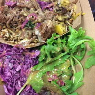 Beef brisket bowl with hot sauce.