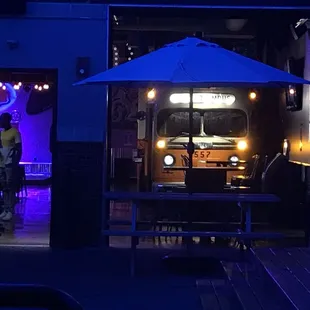 a man standing in front of a truck at night