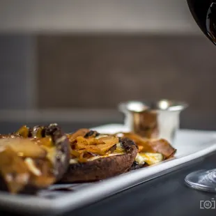 a plate of food and a glass of wine