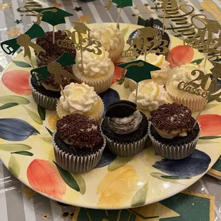 a plate of cupcakes on a table