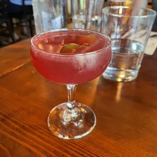 a cocktail in a coupe glass