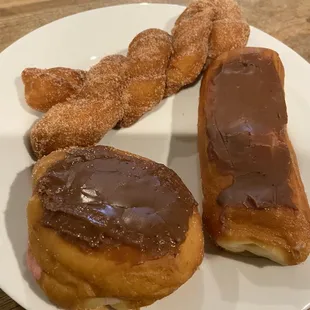 Cinnamon twist, chocolate filled chocolate donut, Bavarian cream filled chocolate donut