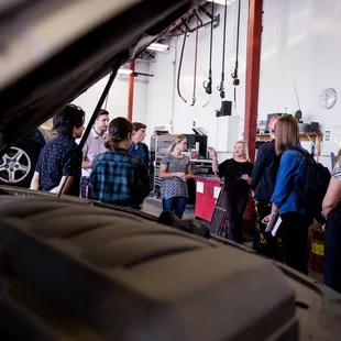 Sandy teaching students about the auto repair industry!