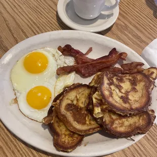 a plate of breakfast food and a cup of coffee