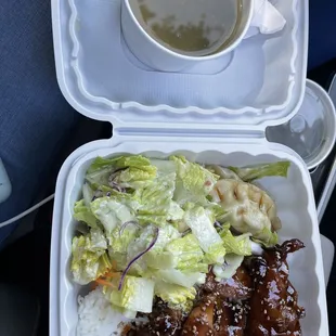 Teriyaki chicken over white rice and potstickers with added Miso soup.