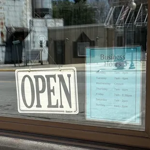 Store hours, closed on Wednesdays.