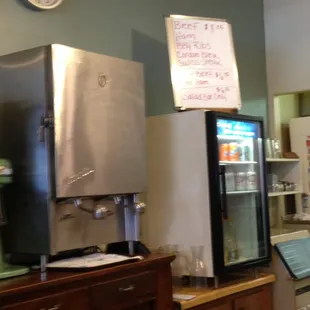 refrigerators and a clock on the wall