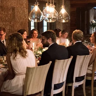 a large group of people sitting at a table