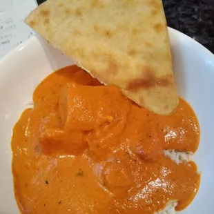 Chicken Tikka Masala with naan home delivered version. Soooo good. An order of naan is four pieces. This is one piece folded in half.