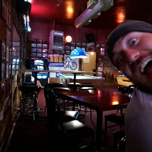 a smiling man in a bar