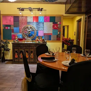 a dining room with a table and chairs