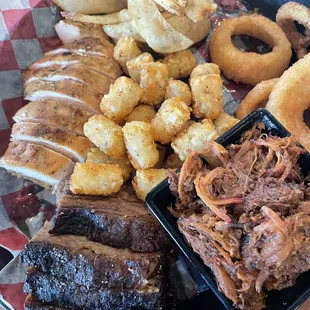 Sample plate, plenty for 2-3 people. Brisket, Chicken Breast and pulled pork.  Thinly sliced fry's, Tater tots and onion rings.