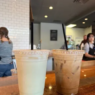 two cups of iced coffee on a table