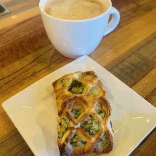 Latte and a spinach and feta pastry