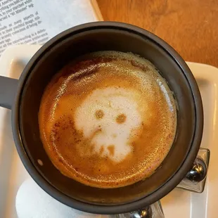 Skull latte with oatmilk and cinnamon with the New York Times in the morning before work