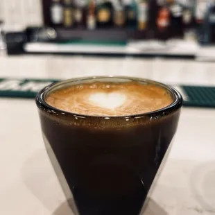 a cup of coffee on a counter