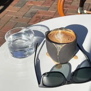 June capachino in the morning sun, street side in old Dayton being reborn
