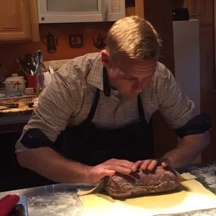 Rolling the roast in pastry.