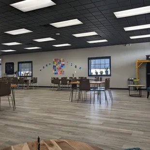 a conference room with tables and chairs