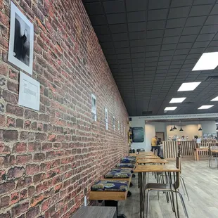 a brick wall and tables