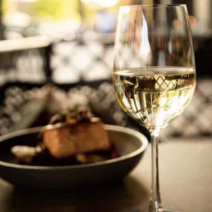 Outdoor seating, wine and salmon will make any night just right