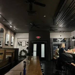 a group of people sitting at a bar