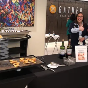 "Wine Down Wednesdays" setup with complimentary wine, cheese, crackers and other snacks.