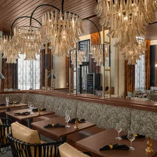 a restaurant with a long bar and a long dining table