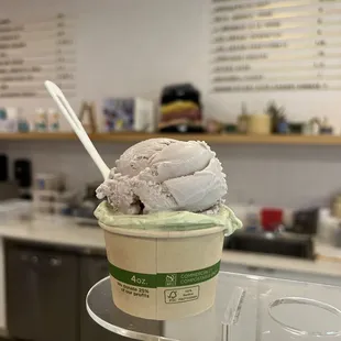 a cup of ice cream with a spoon in it