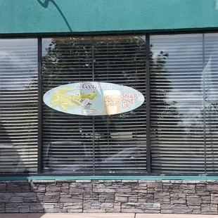 a surfboard in the window
