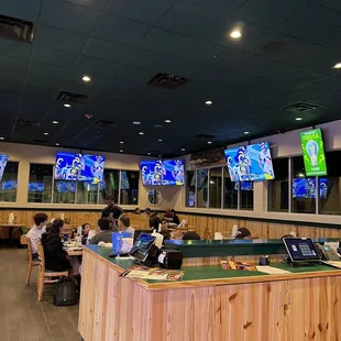 Dining room with so many TV's