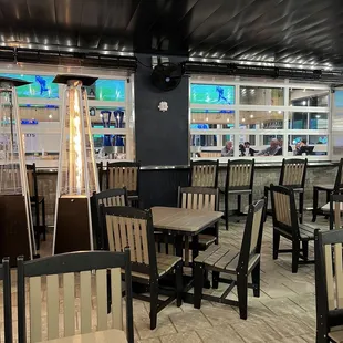 Outdoor seating with garage doors down due to chilly January weather but duel bar seating like most Gator locations