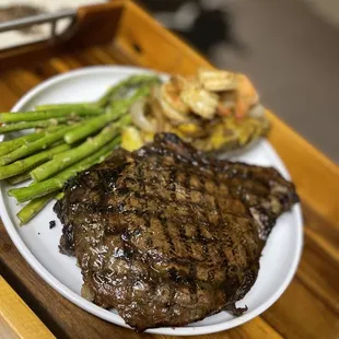 a steak and asparagus on a plate